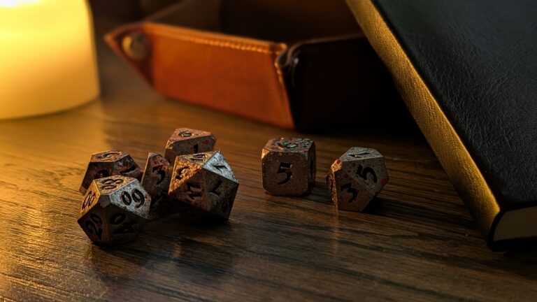 Hero photo of Die Hard Dice Bloody Starrazor set on wooden table with dramatic side light.