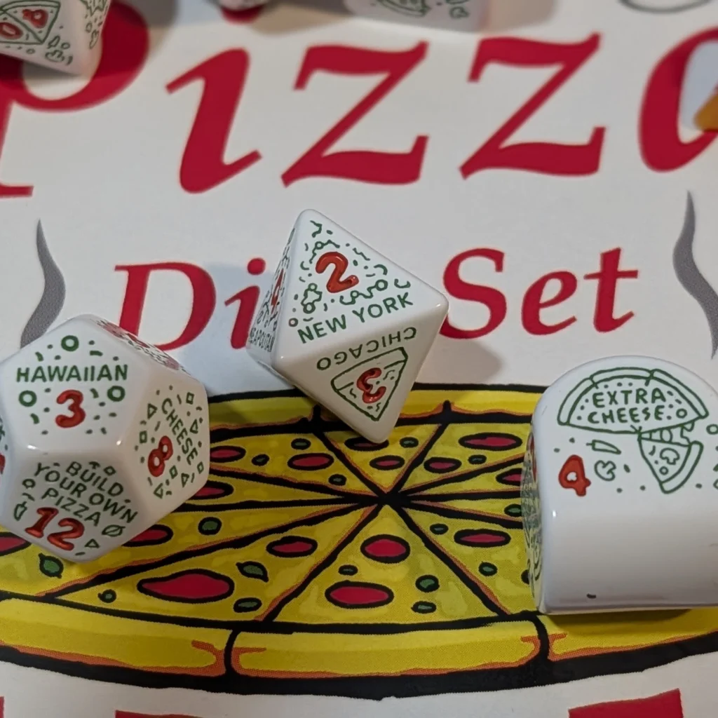 Close up of d4, d8 and d12 with themed labels
